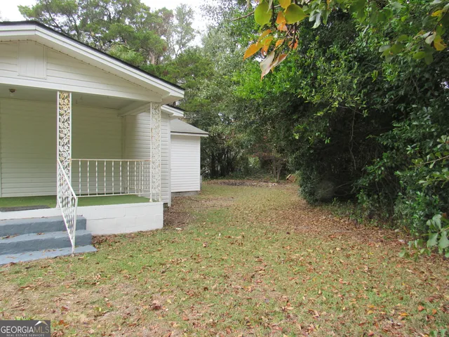 a house with trees in the background