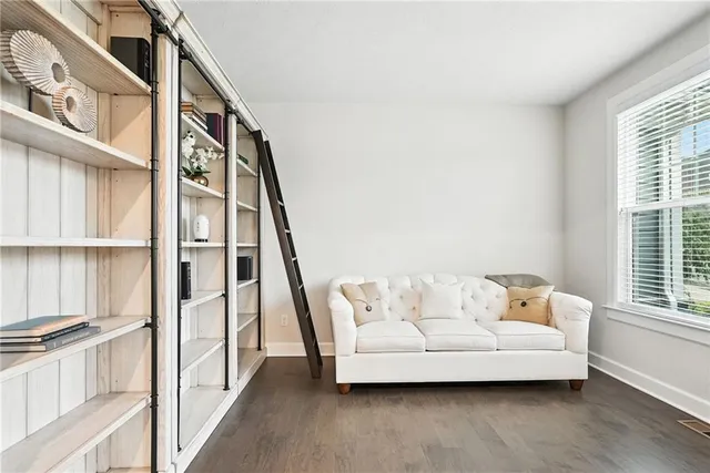 a view of livingroom with furniture and staircase