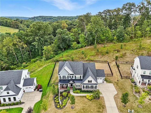 a view of a swimming pool with a patio and a yard