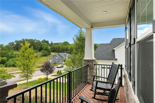 a view of a balcony with furniture