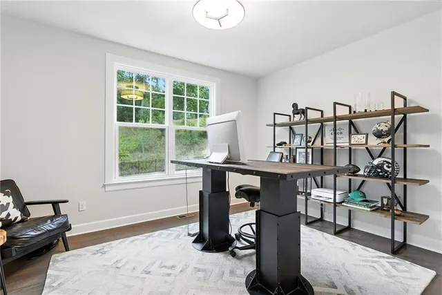 a dining room with furniture and a window