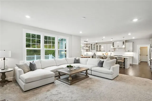 a living room with furniture and a large window