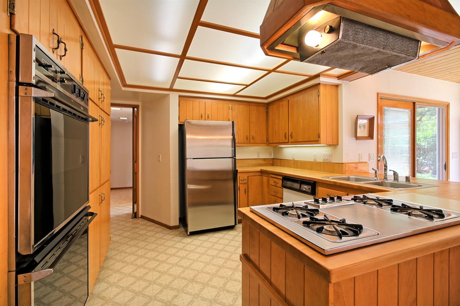 205 Palomar Road Ojai, CA 93023 - Photo 15 of 38 a kitchen with stainless steel appliances granite countertop a stove and a refrigerator