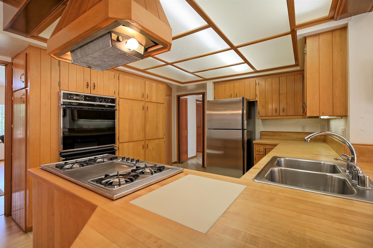 205 Palomar Road Ojai, CA 93023 - Photo 16 of 38 a kitchen with stainless steel appliances granite countertop a sink and a refrigerator