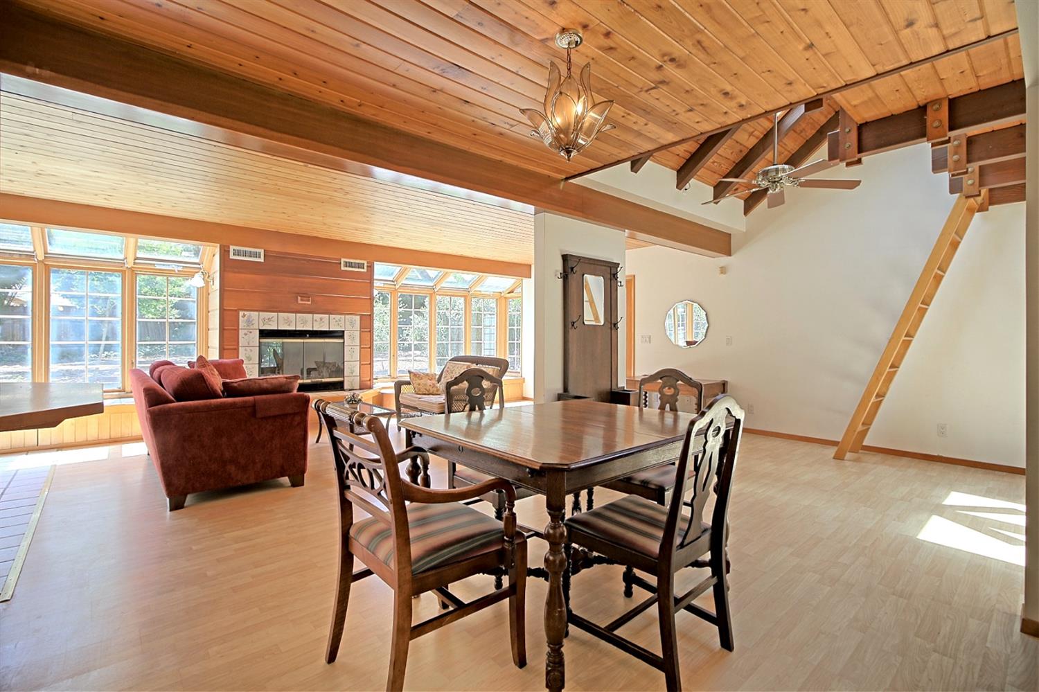 205 Palomar Road Ojai, CA 93023 - Photo 17 of 38 a dining room with furniture a chandelier and wooden floor
