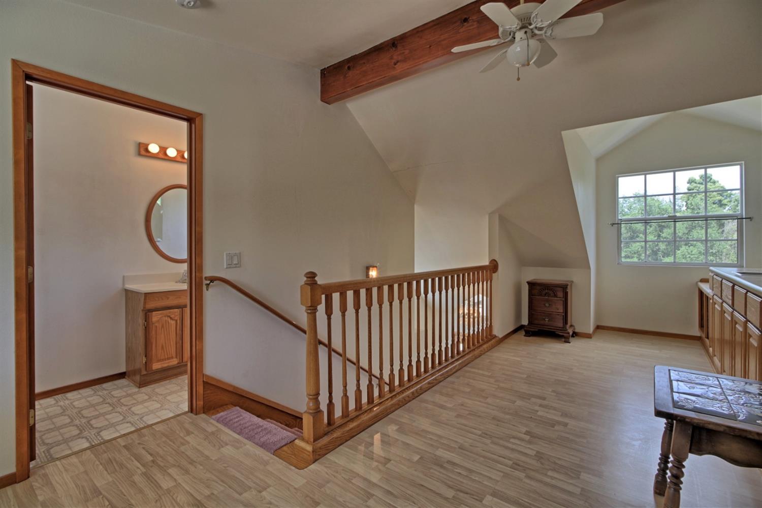 205 Palomar Road Ojai, CA 93023 - Photo 31 of 38 a view of a hallway with windows and stairs