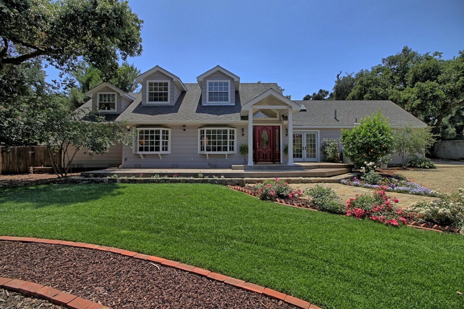 205 Palomar Road Ojai, CA 93023 - Photo 5 of 38 a front view of a house with a garden
