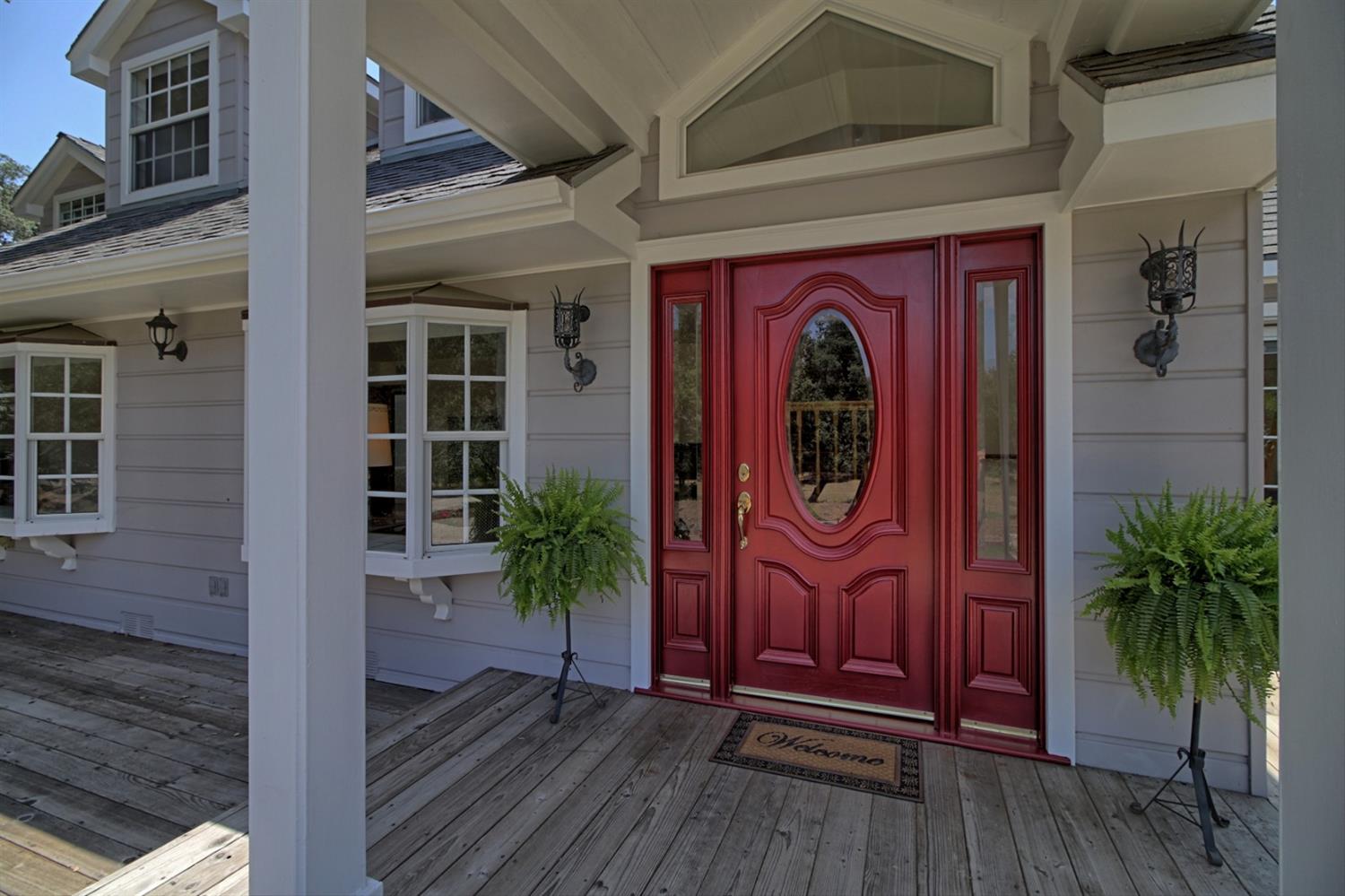205 Palomar Road Ojai, CA 93023 - Photo 8 of 38 a front view of a house with entryway and wooden floor