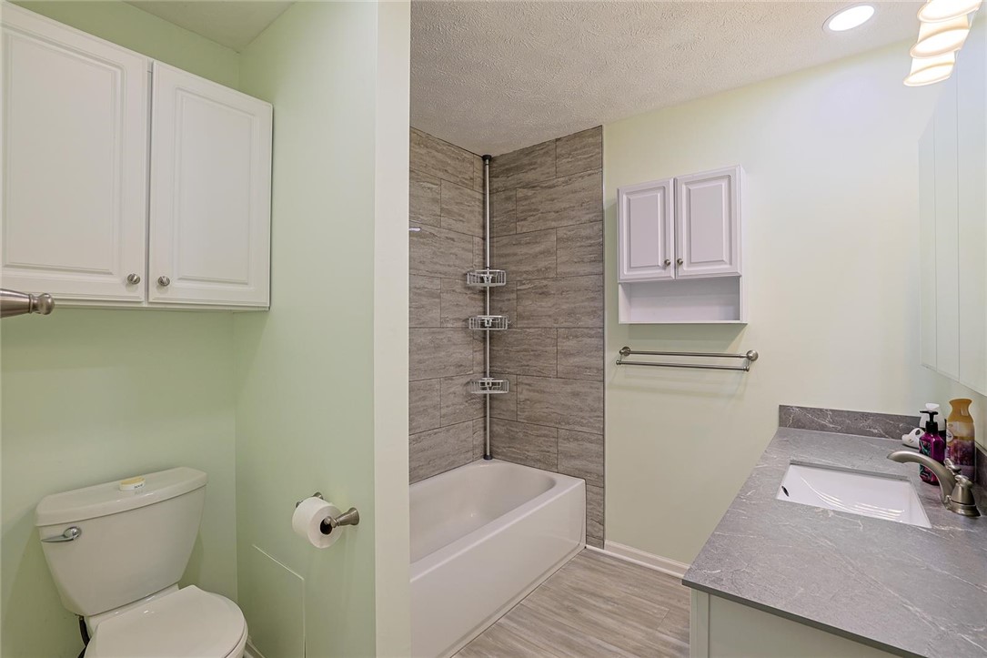4307 Meadowcroft Road Dayton, OH 45429 - Photo 15 of 26 This clean and bright bathroom features a tub, shower combination, and vanity with ample storage.
