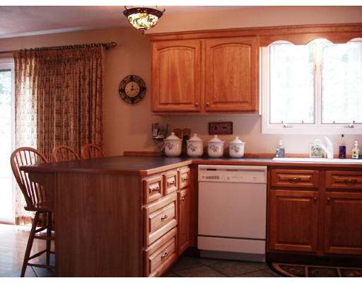 57 Holden Road Shirley, MA 01464 - Photo 4 of 18 a kitchen with stainless steel appliances granite countertop a sink a stove and a refrigerator