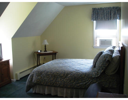 57 Holden Road Shirley, MA 01464 - Photo 10 of 18 a bedroom with a bed and a window