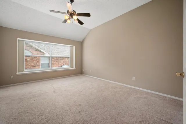 a bathroom with a tub a sink and a mirror