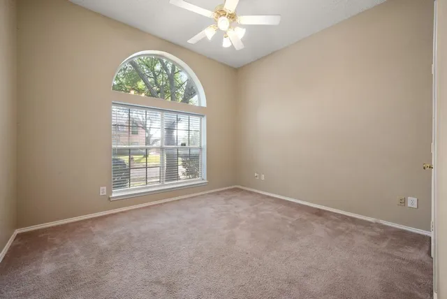 a bathroom with a granite countertop sink a toilet and a bathtub