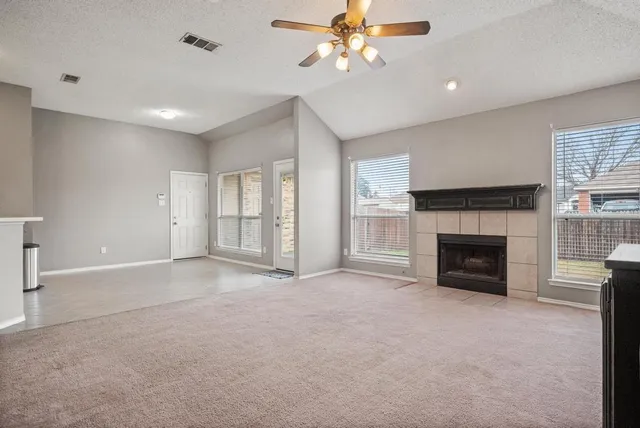 a large white kitchen with kitchen island a refrigerator a stove and a sink