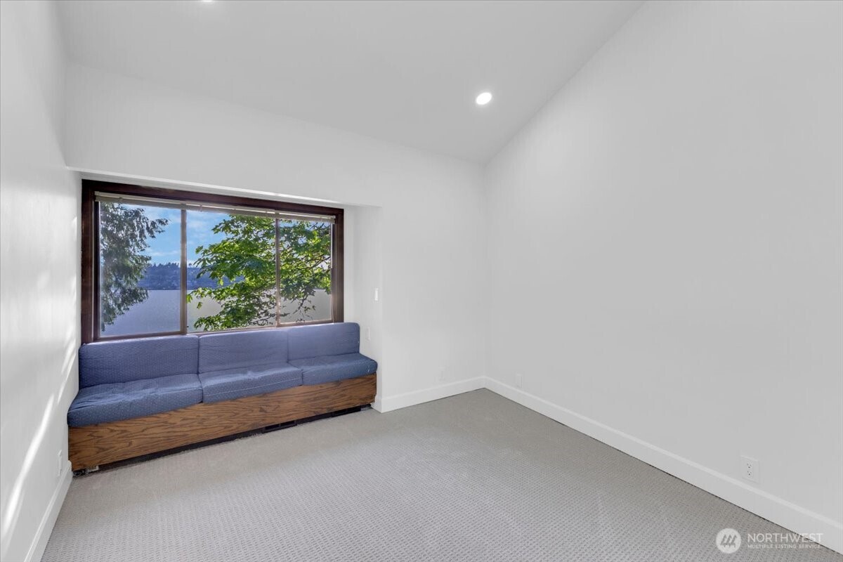 16015 Inglewood Road Northeast Kenmore, WA 98028 - Photo 17 of 37 a room with bench and window