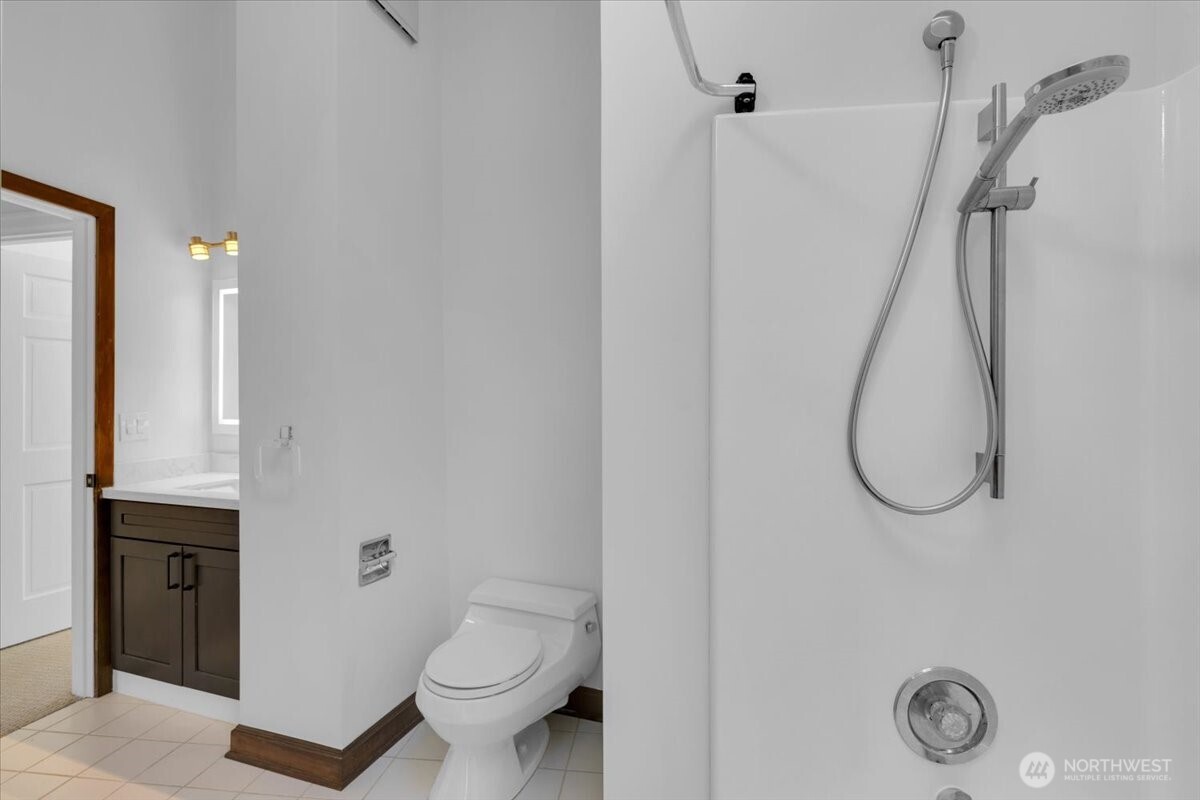 16015 Inglewood Road Northeast Kenmore, WA 98028 - Photo 20 of 37 a bathroom with a toilet and a sink