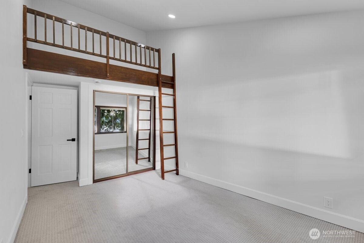 16015 Inglewood Road Northeast Kenmore, WA 98028 - Photo 22 of 37 an empty room with windows