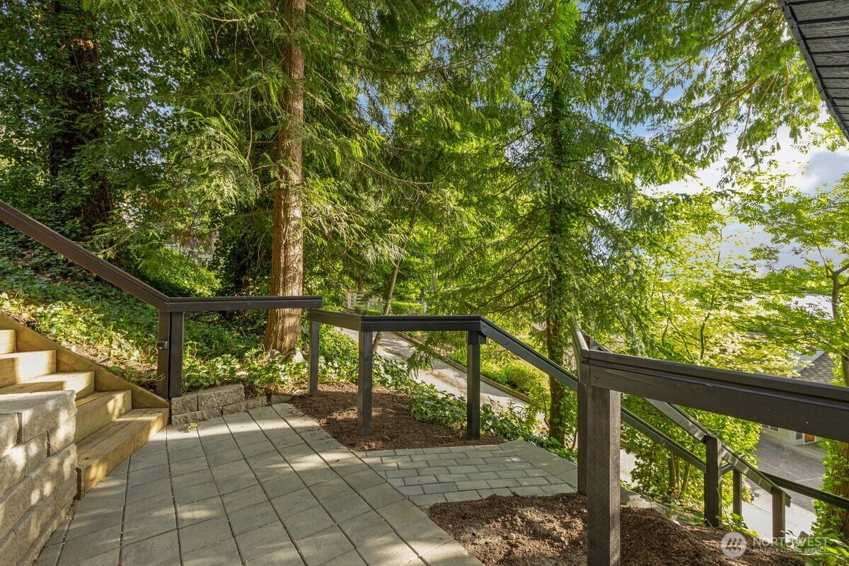 16015 Inglewood Road Northeast Kenmore, WA 98028 - Photo 23 of 37 a view of a balcony with a tree