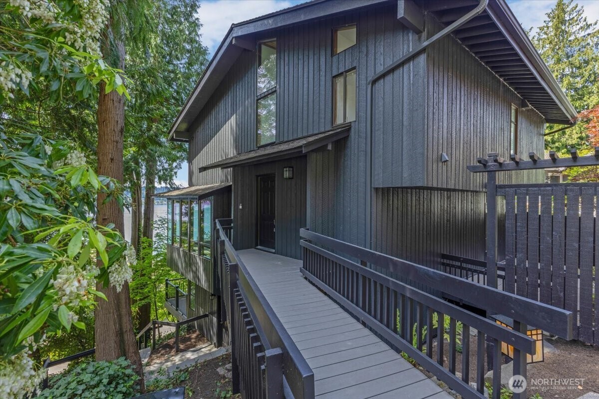 16015 Inglewood Road Northeast Kenmore, WA 98028 - Photo 3 of 37 a view of a house with wooden deck