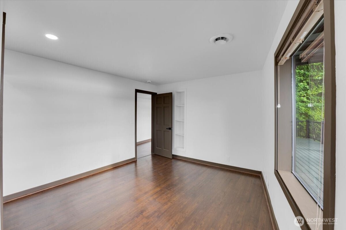 16015 Inglewood Road Northeast Kenmore, WA 98028 - Photo 32 of 37 a view of an empty room with a window