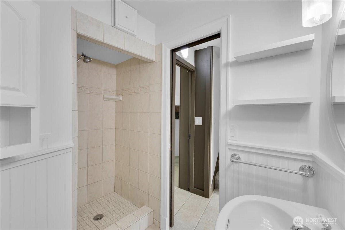 16015 Inglewood Road Northeast Kenmore, WA 98028 - Photo 33 of 37 a bathroom with a shower and toilet