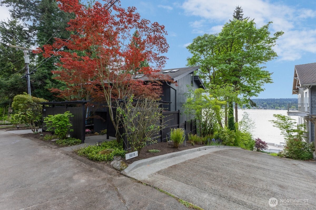16015 Inglewood Road Northeast Kenmore, WA 98028 - Photo 4 of 37 front view of a house with a tree