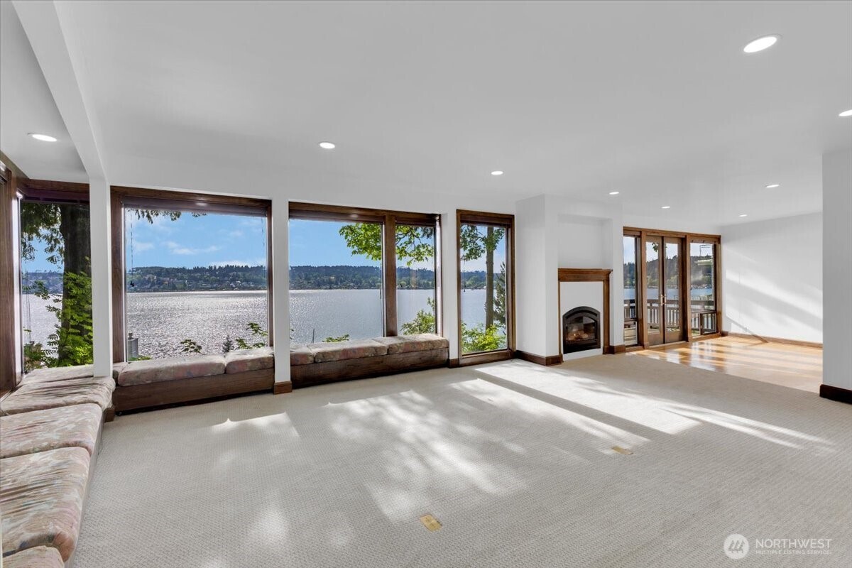 16015 Inglewood Road Northeast Kenmore, WA 98028 - Photo 8 of 37 a view of a livingroom with furniture and floor to ceiling window
