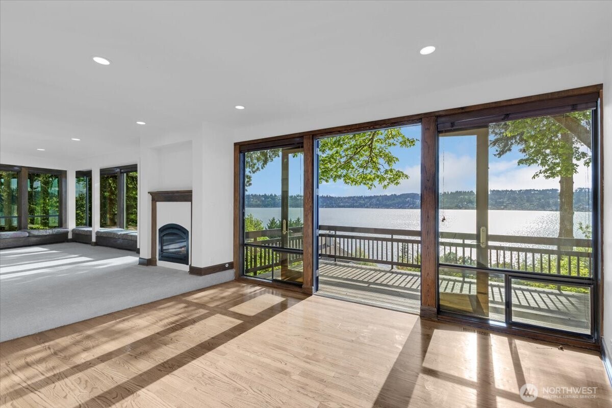 16015 Inglewood Road Northeast Kenmore, WA 98028 - Photo 9 of 37 a view of a living room and a large windows