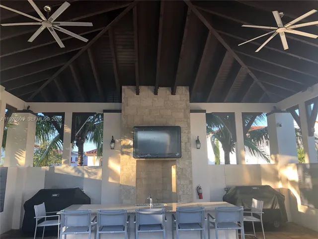 a living room filled with furniture and a flat screen tv