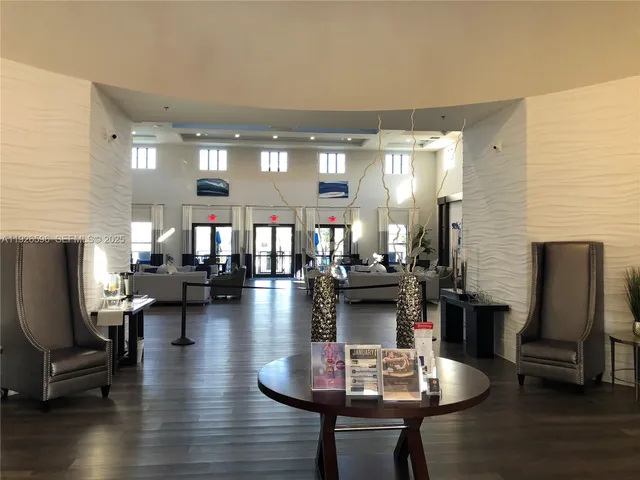 a living room with fireplace furniture and a wooden floor