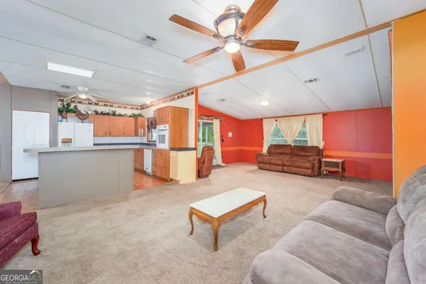 a living room with furniture and a yard