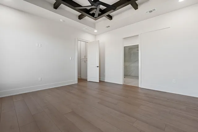 a spacious bathroom with a double vanity sink a mirror and a bathtub