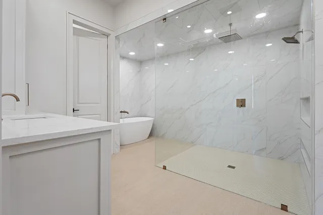 a bathroom with a bathtub and shower