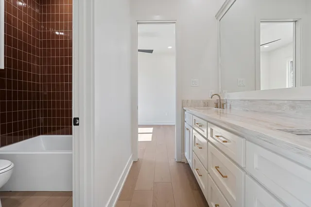 a bathroom with a bathtub and a shower