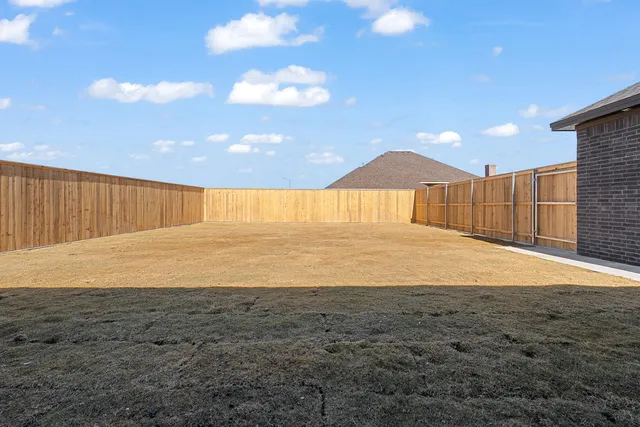 a view of a lake with a house in the background