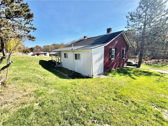 a backyard of a house with yard and garage