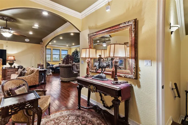 a view of a livingroom with furniture and a large window