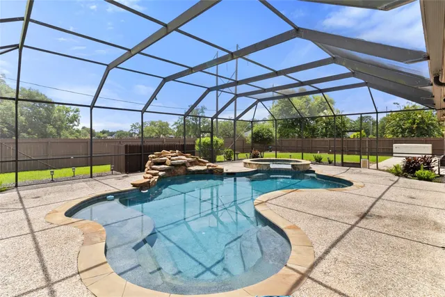 a view of a swimming pool with a patio