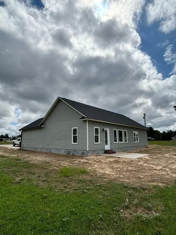 a backyard of a house with lots of green space