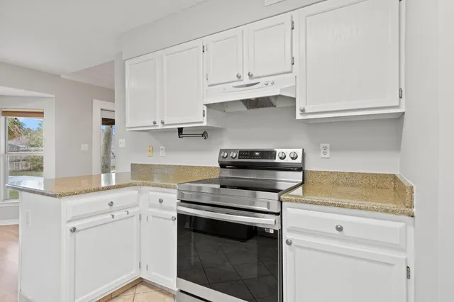 a kitchen with appliances cabinets and a sink