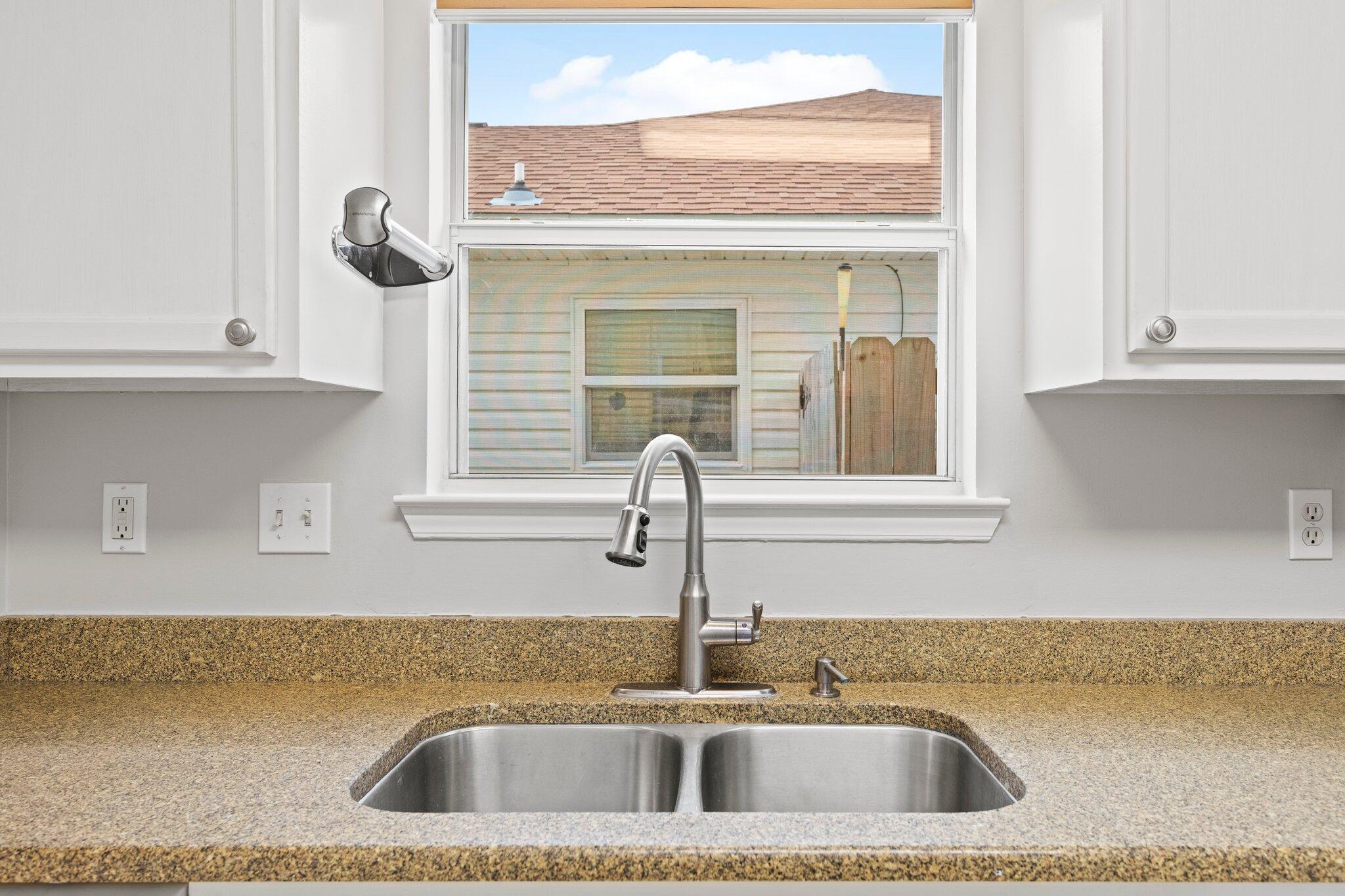 3621 Goldsbys Way Destin, FL 32541 - Photo 13 of 43 a close view of a sink and dishwasher next to a window