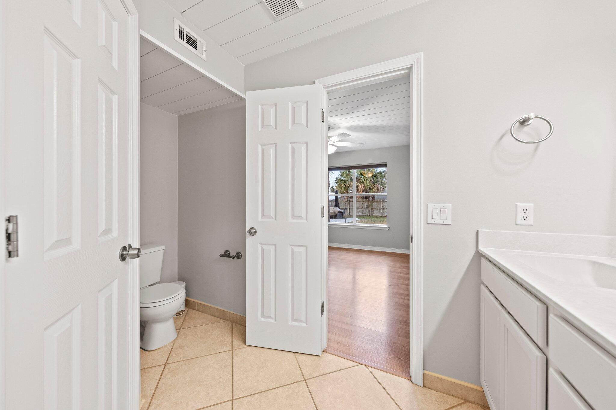 3621 Goldsbys Way Destin, FL 32541 - Photo 23 of 43 a bathroom with a sink a toilet and shower