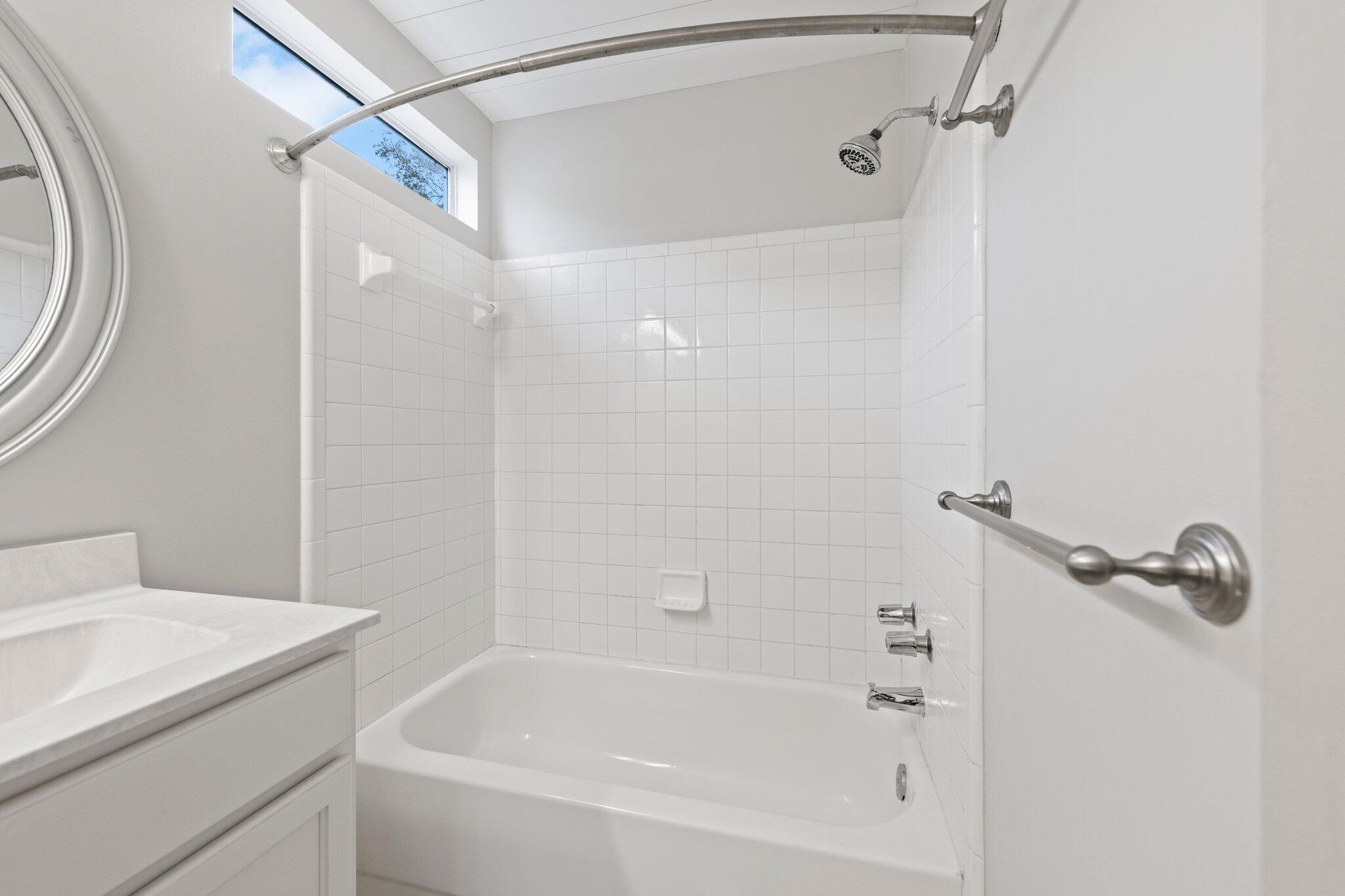 3621 Goldsbys Way Destin, FL 32541 - Photo 25 of 43 a bathroom with a bathtub and a shower