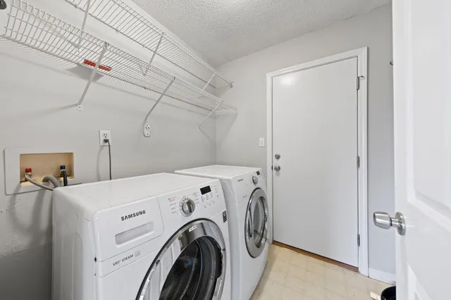 a view of a backyard with sitting area