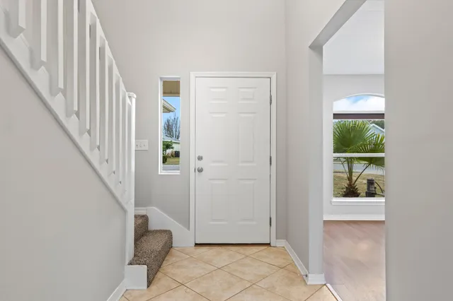 a view of a hallway view with staircase