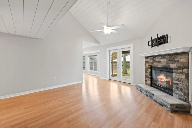a kitchen with white cabinets and appliances