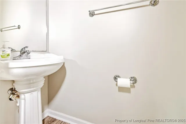 a bathroom with a sink a mirror and a shower