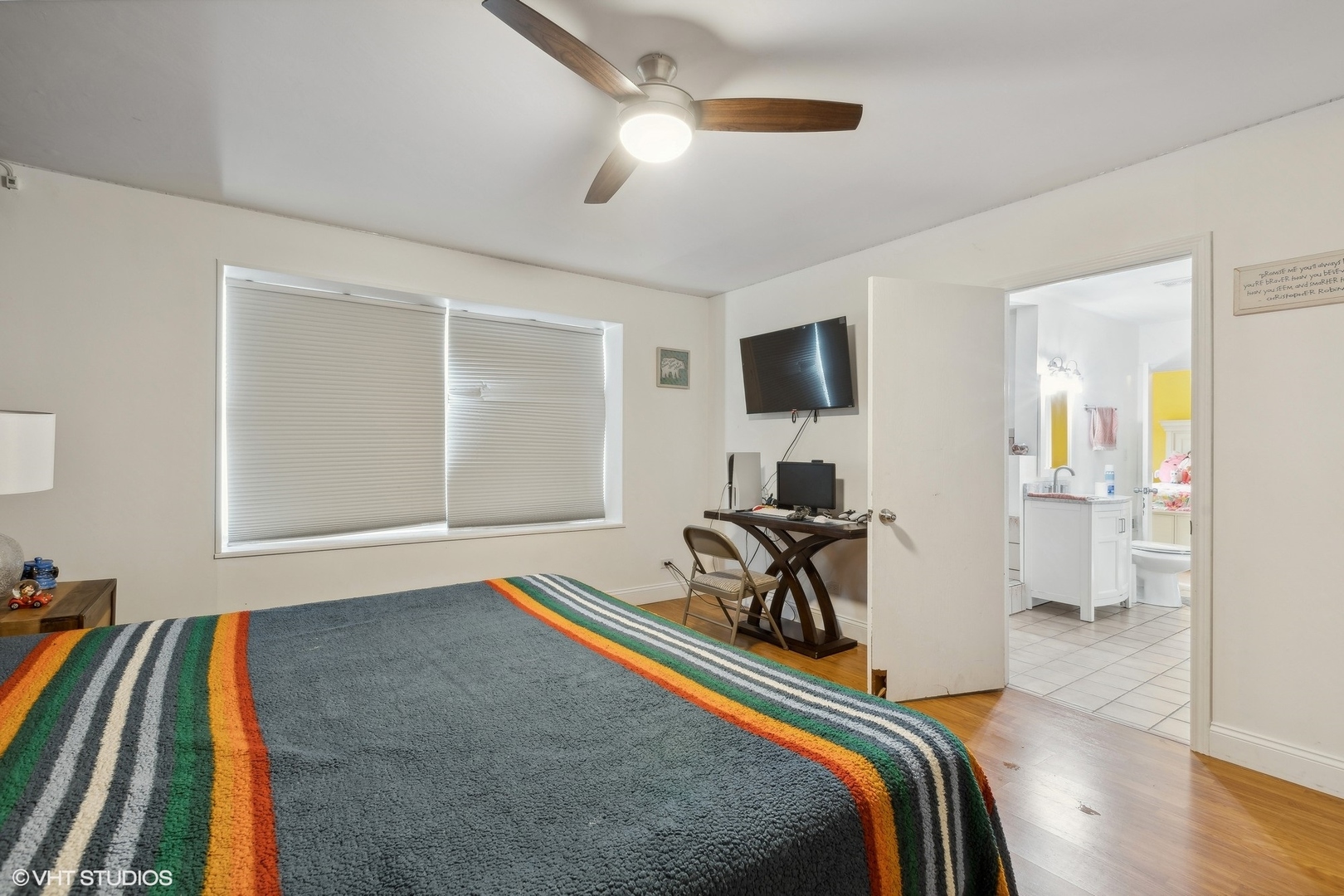 3243 Gresham Lane East Aurora, IL 60504 - Photo 16 of 28 a bedroom with a bed and a chandelier