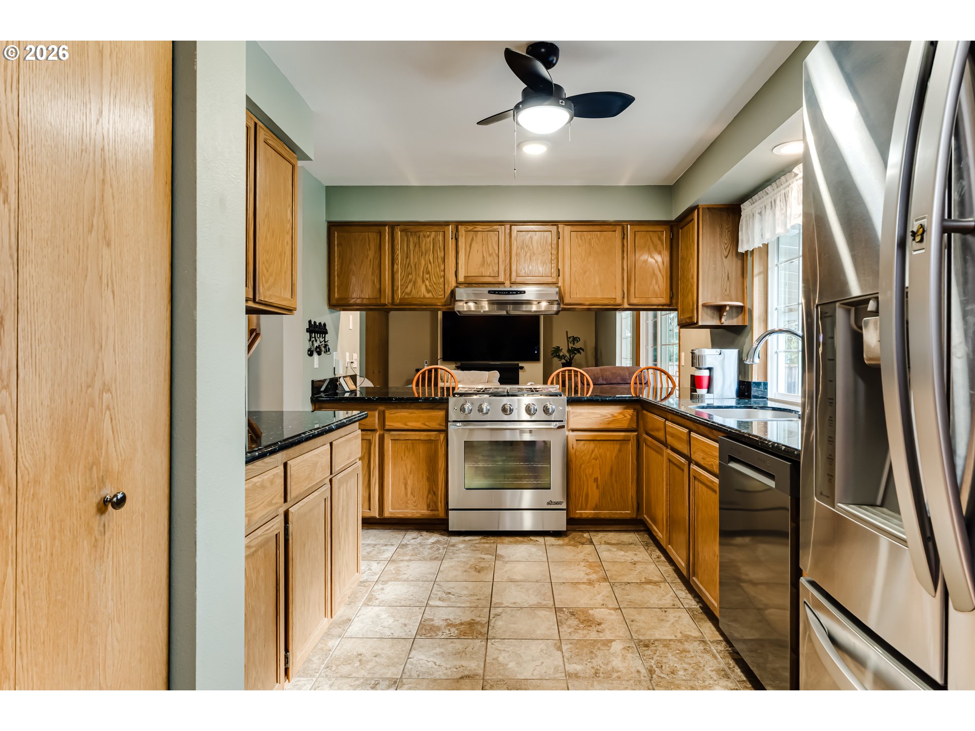 5131 Trevon Street Eugene, OR 97402 - Photo 11 of 42 a kitchen with a refrigerator and a sink
