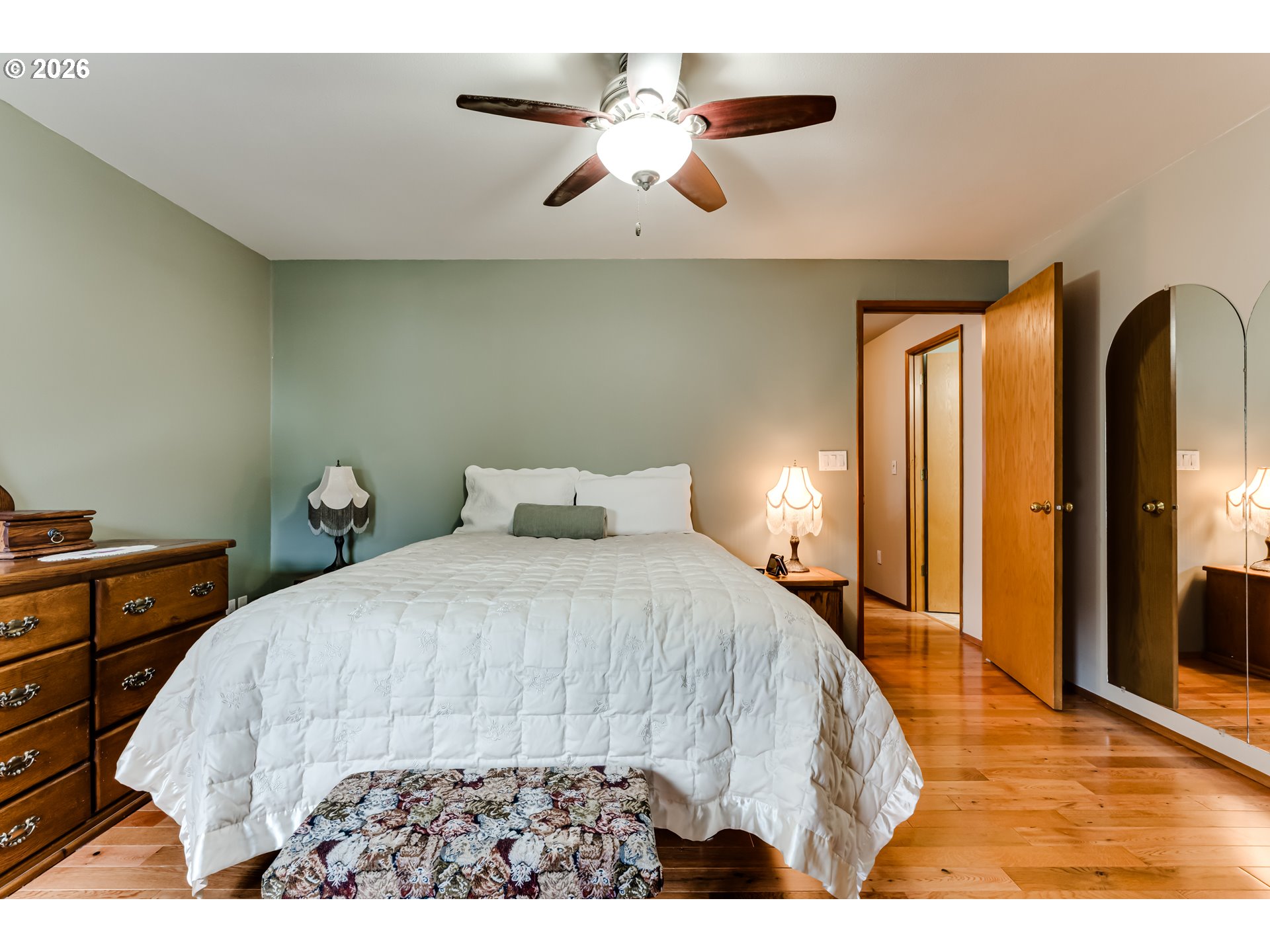 5131 Trevon Street Eugene, OR 97402 - Photo 20 of 42 a bedroom with a bed and a chandelier